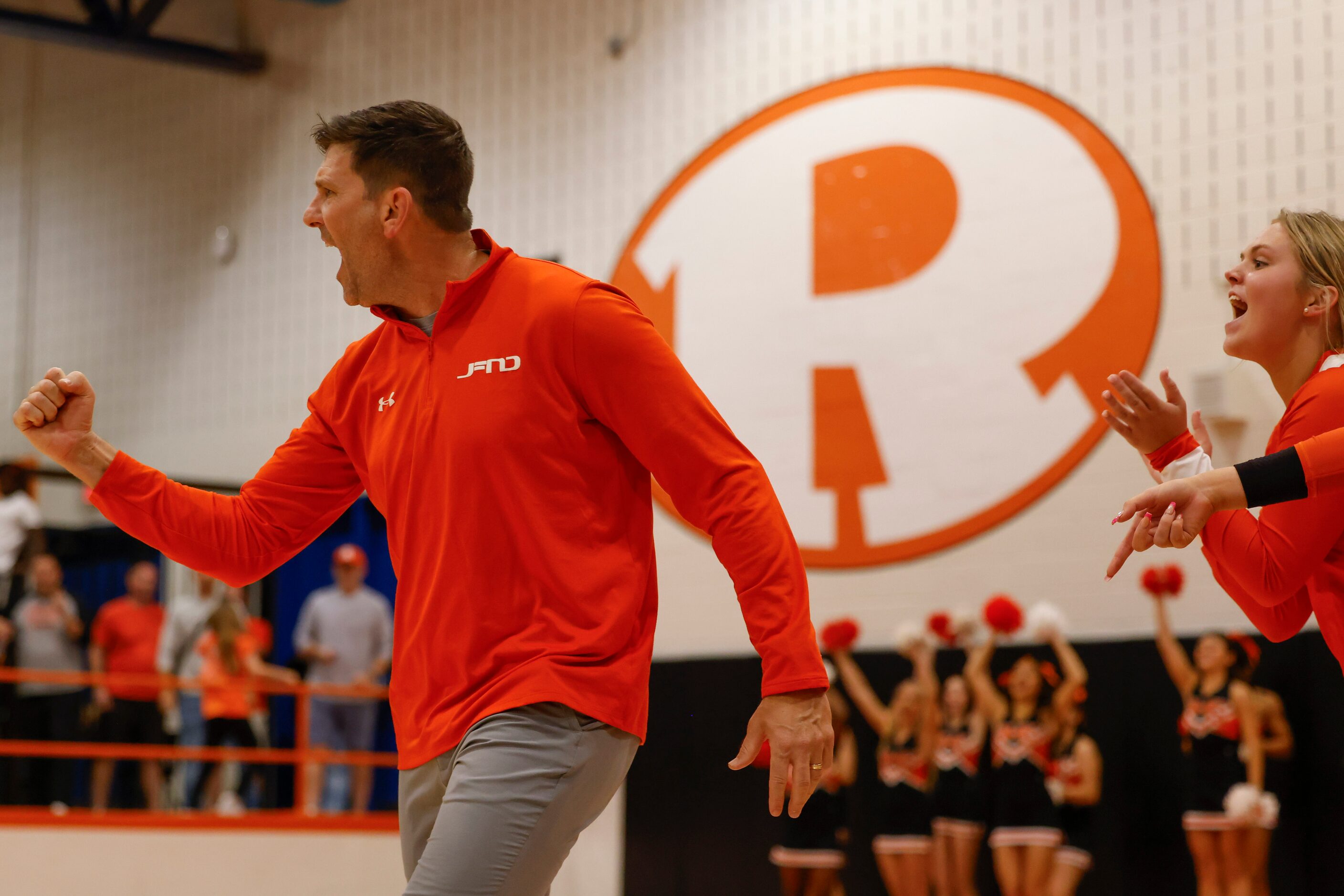 Rockwall high’s head coach Travis Ferguson cheer towards the team after a comeback point on...