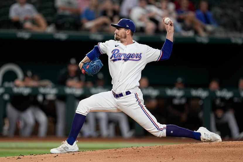 Texas Rangers starting pitcher Andrew Heaney throws to the Chicago White Sox in the first...