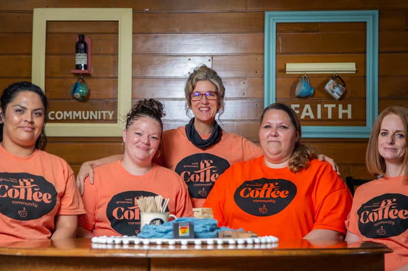 Well Grounded Coffee Community owner Natalie Huscheck (center) says her life has been...