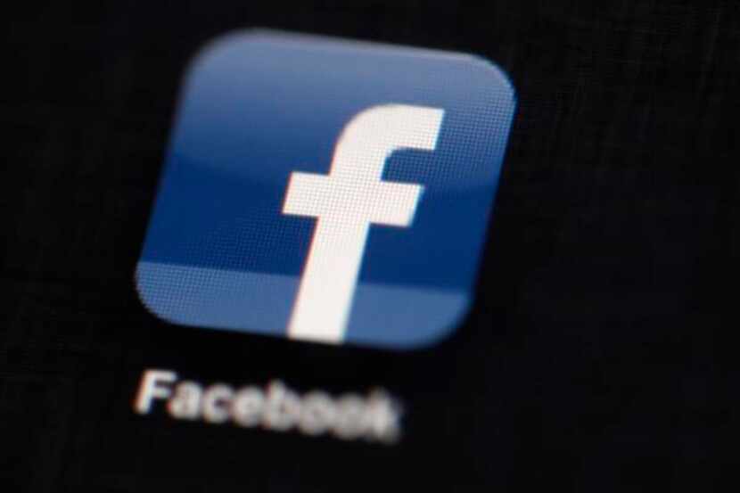 FILE - This May 16, 2012 file photo shows the Facebook logo displayed on an iPad in...