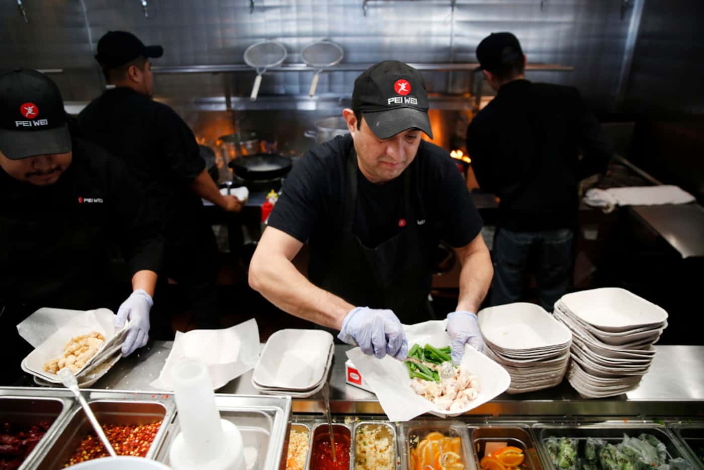 Gustavo Franco, wok cook, prepared a dish at Pei Wei in Irving on Feb. 7.