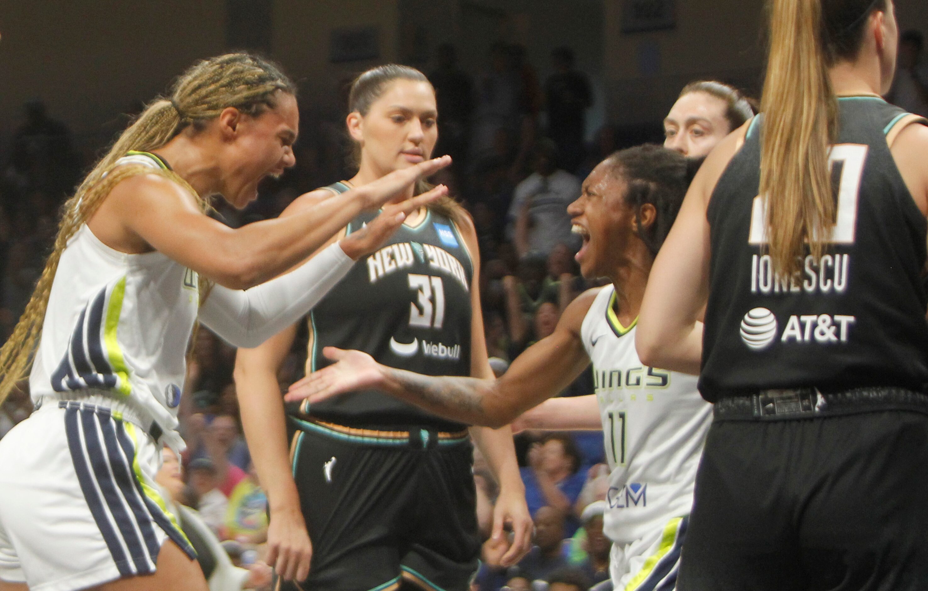 Dallas Wings forward Satou Sabally (0), left, and Wings guard Crystal Dangerfield (11) break...