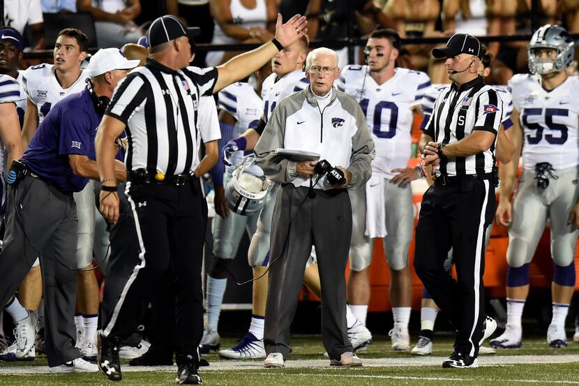 Kansas State head coach Bill Snyder, center, talks with officials in the second half of an...