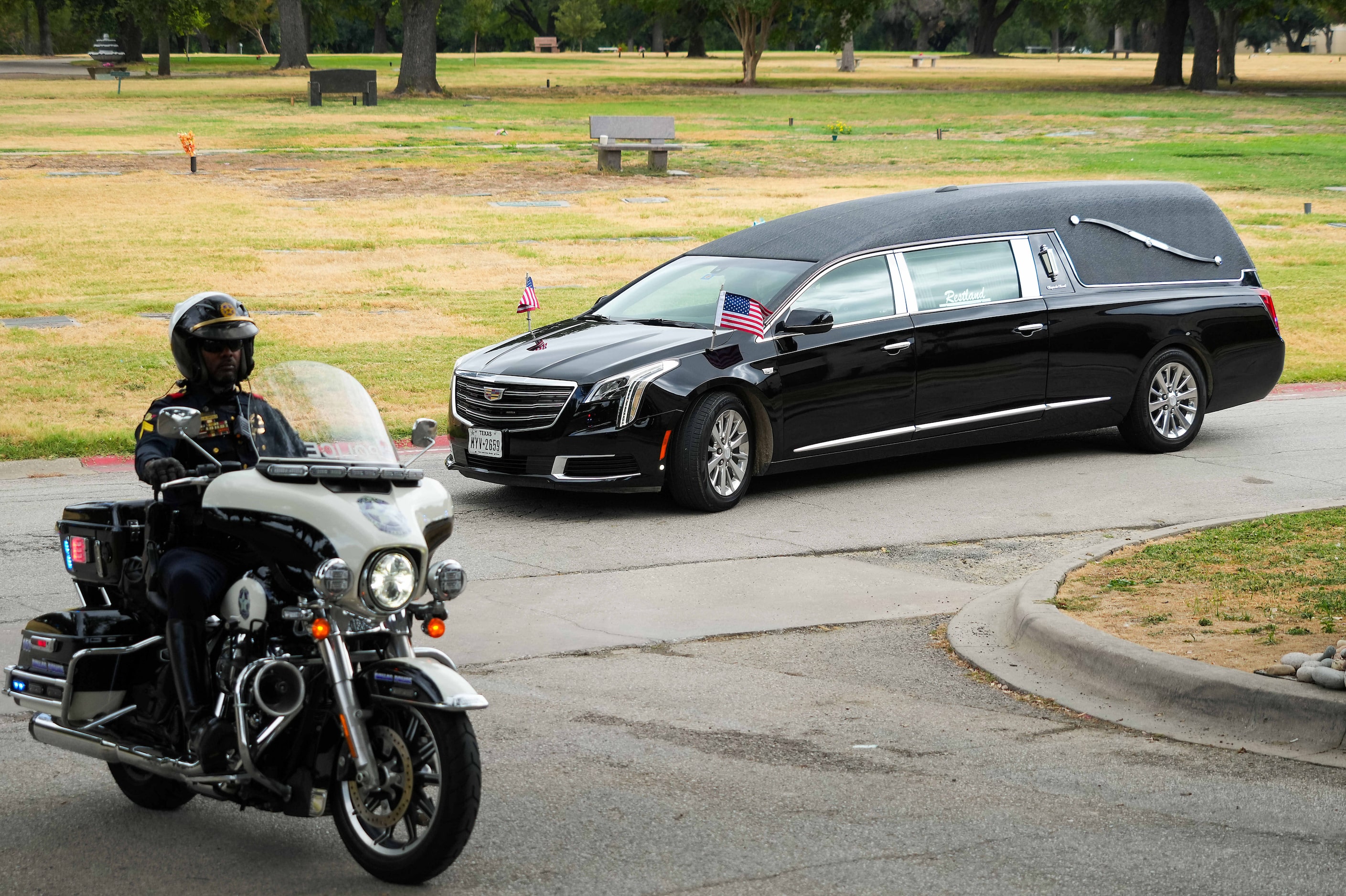 A hearse arrives at Restland Funeral Home as fallen Dallas Police officer Darron Burks is...