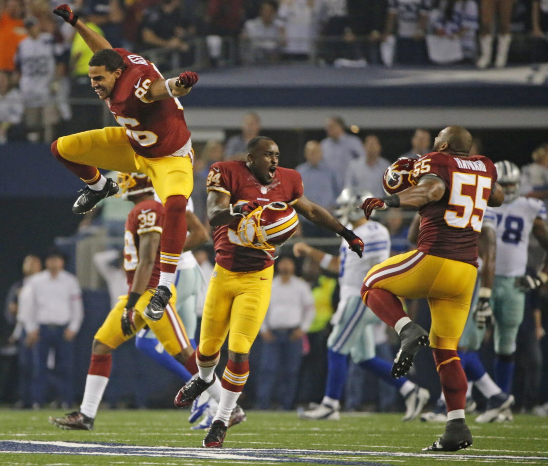 Washington Redskins Jordan Reed (86),  Trenton Robinson (34) and Adam Hayward (55) celebrate...