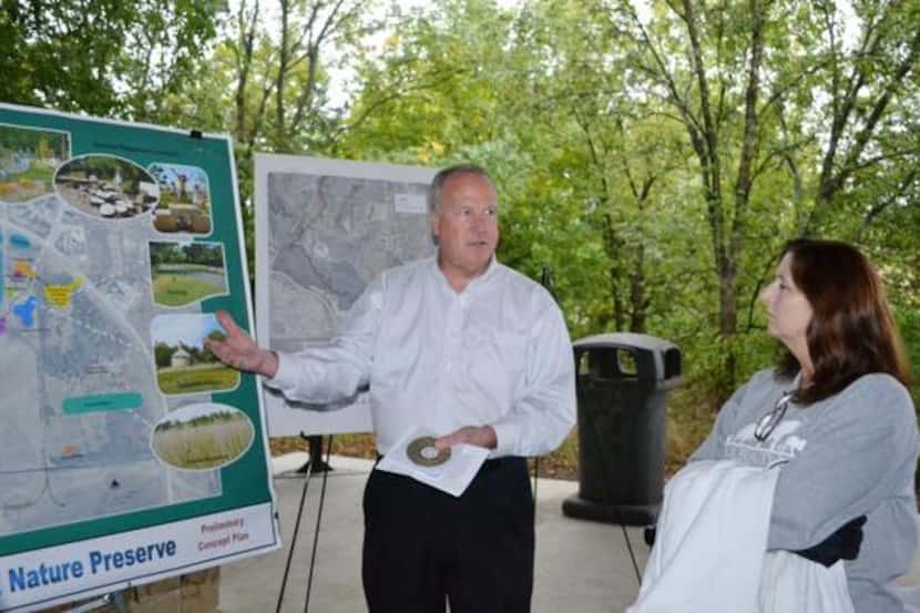 
Robin Reeves (left), chief park planner for the city of Plano, discusses plans and updates...