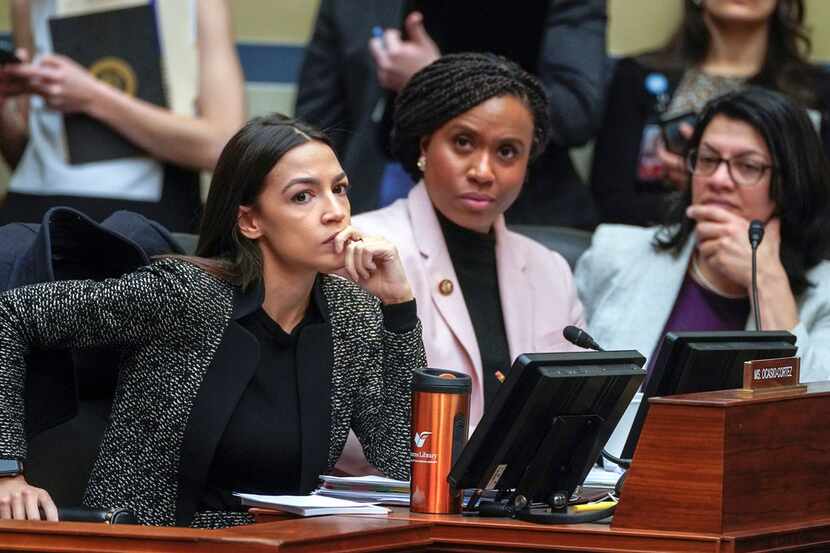 Rep. Alexandria Ocasio-Cortez (left), D-N.Y., joined by Rep. Ayanna Pressley, D-Mass., and...