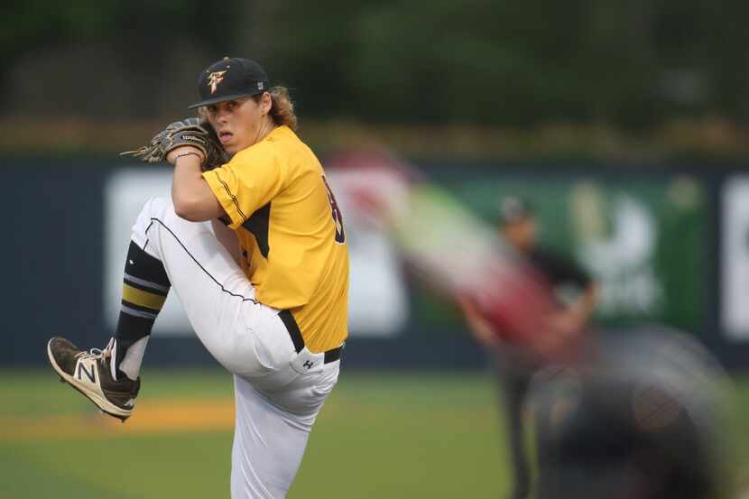 Forney pitcher Mason Englert (8) delivers a pitch to a Frisco Centennial batter during the...