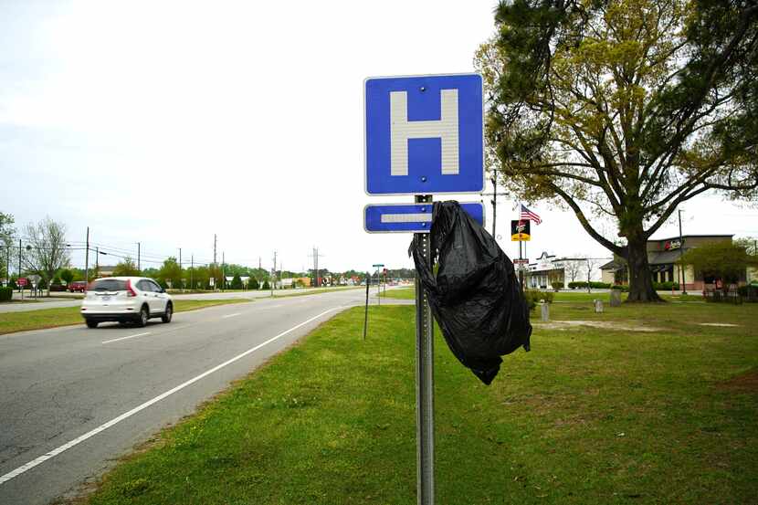 A garbage bag hangs from a hospital sign along U.S. 17 in Williamston, N.C., on Thursday,...