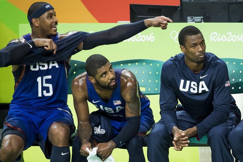 Carmelo Anthony (15) of USA points to Harrison Barnes (8) on the bench during the men's gold...