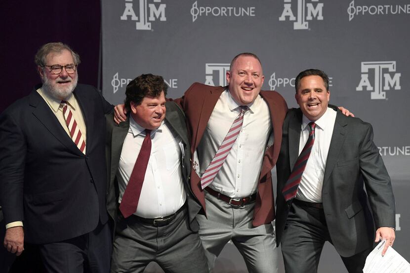 Texas A&M University System Board of Regents Chairman Charles Schwartz, left, joins athletic...