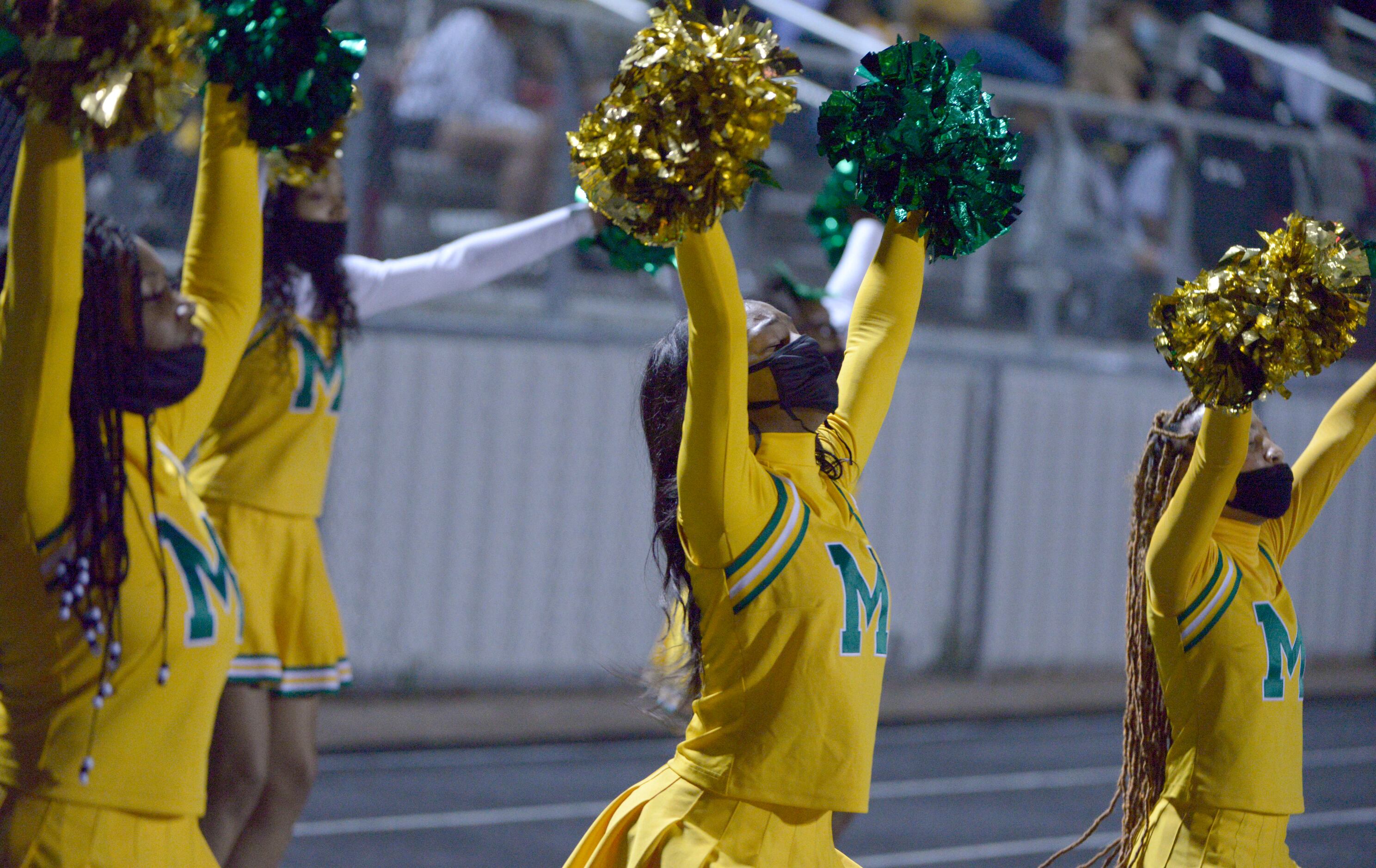 Madison cheerleader perform in the first quarter during a Class 3A Division I area-round...
