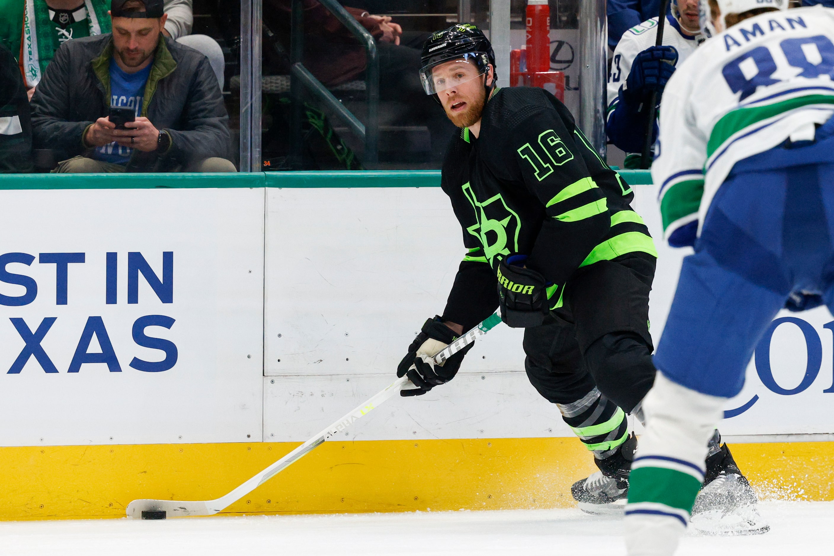 Dallas Stars center Joe Pavelski (16) looks to pass the puck during the first period of an...