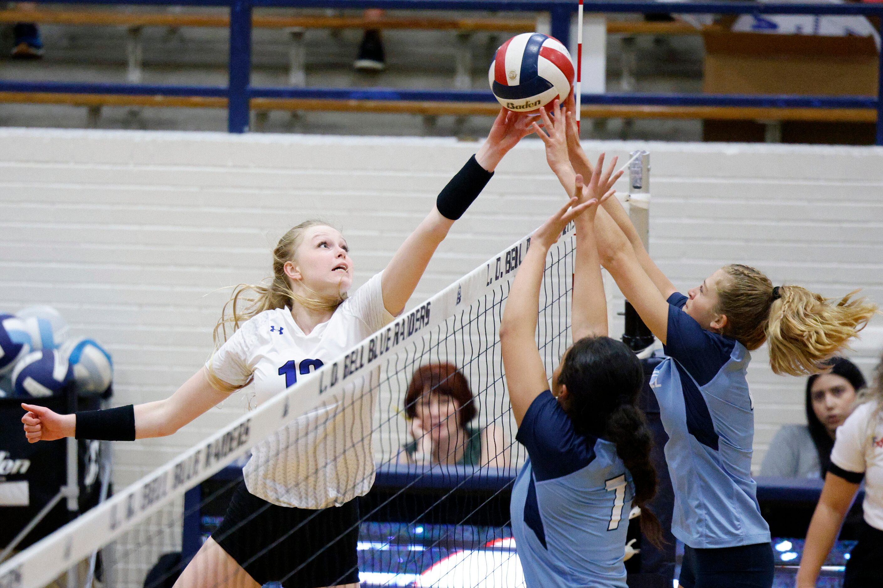 Trophy Club Byron Nelson's Ashlyn Seay (12) tries to tip the ball over the block of L.D....