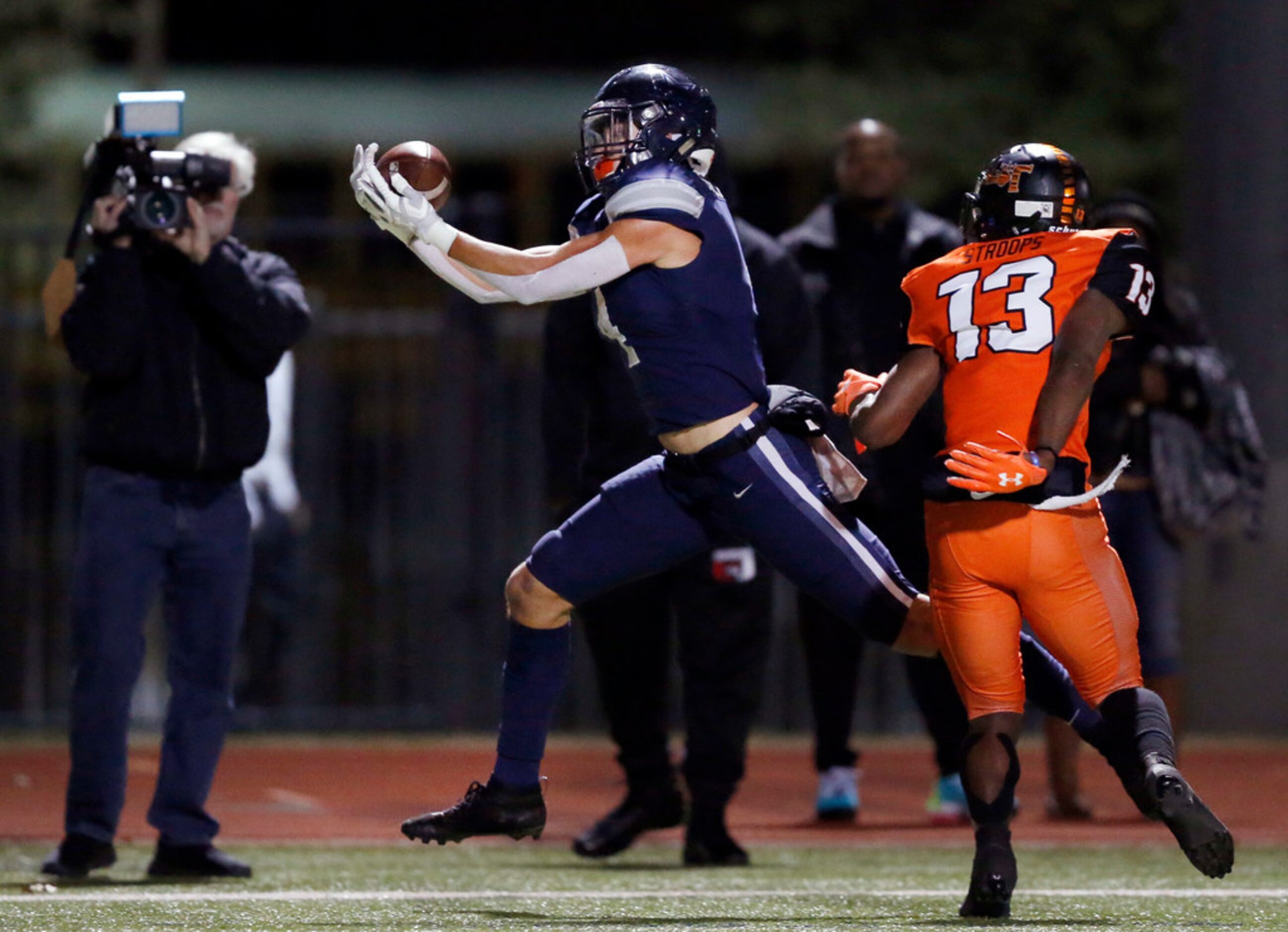 Frisco Lone Star wide receiver Trace Bruckler (4) hauls in a first quarter touchdown pass...