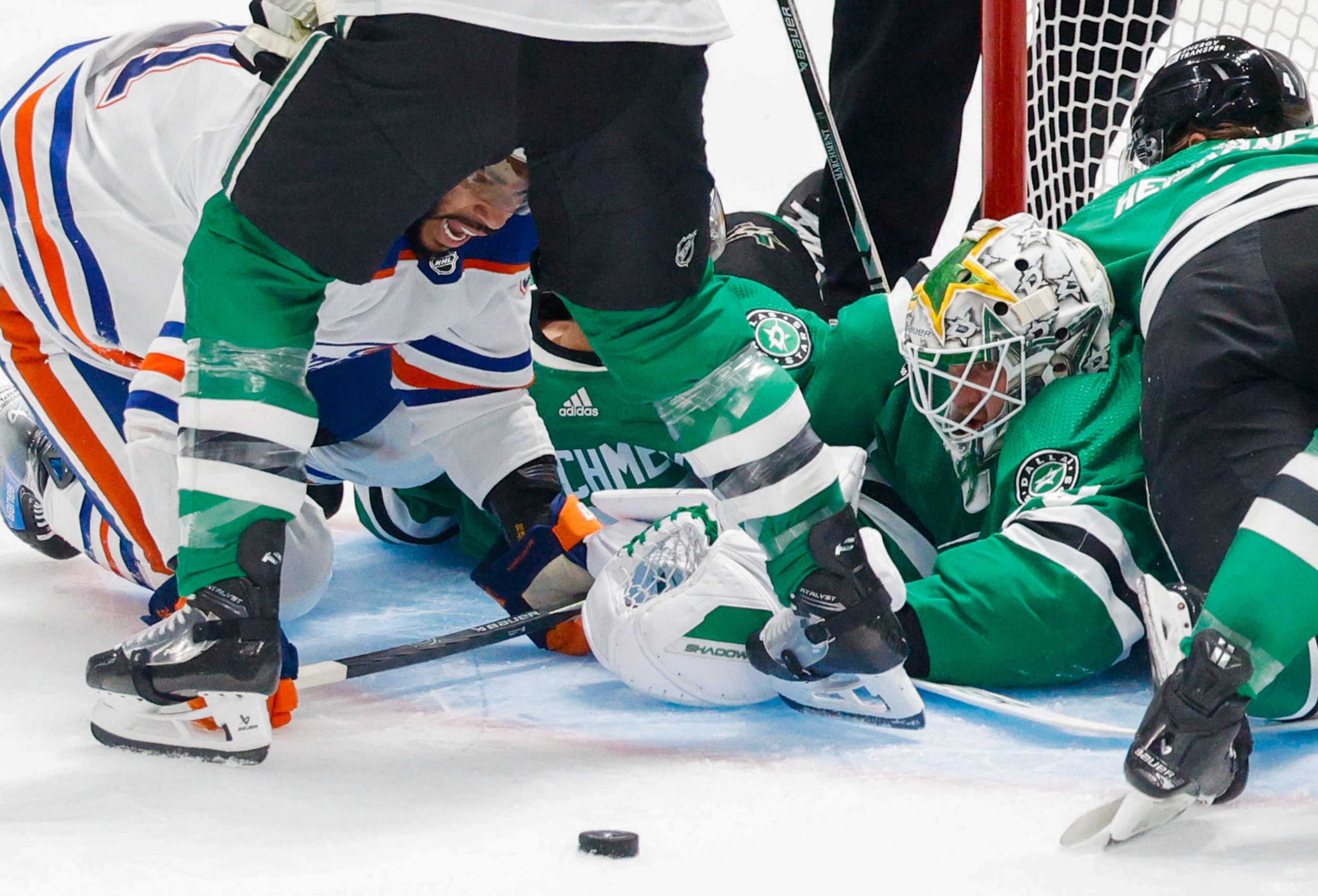 Edmonton Oilers left wing Evander Kane (91), left, and Dallas Stars goaltender Jake...