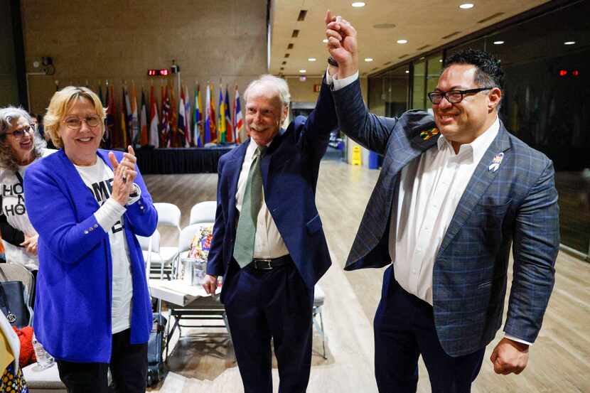 Olive Talley, a leader in the Dallas Neighborhood Coalition (left), claps as Dallas City...