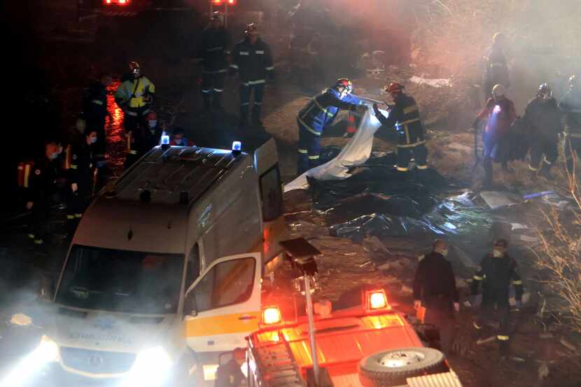Firefighters pulled bodies from the wreckage after arriving on the scene of the train...