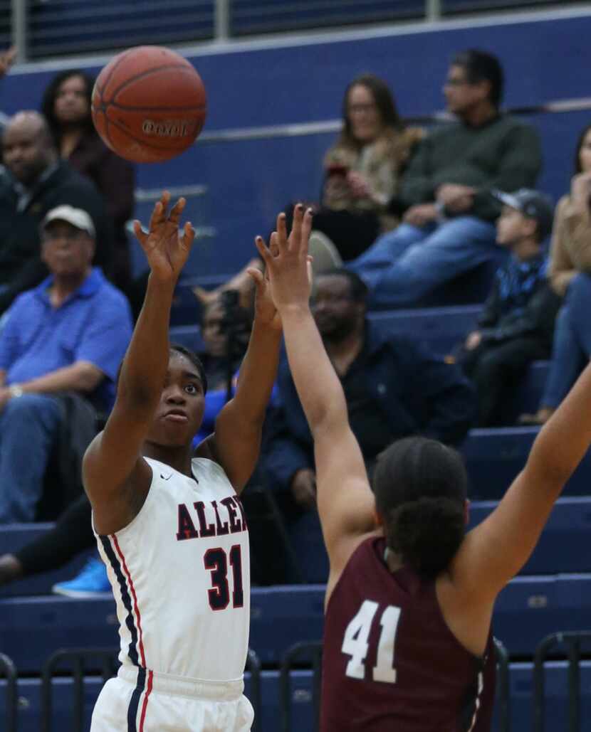 Allen's JaMaya Johnson shoots the ball against Plano guard Zaria Collins (41) in the first...