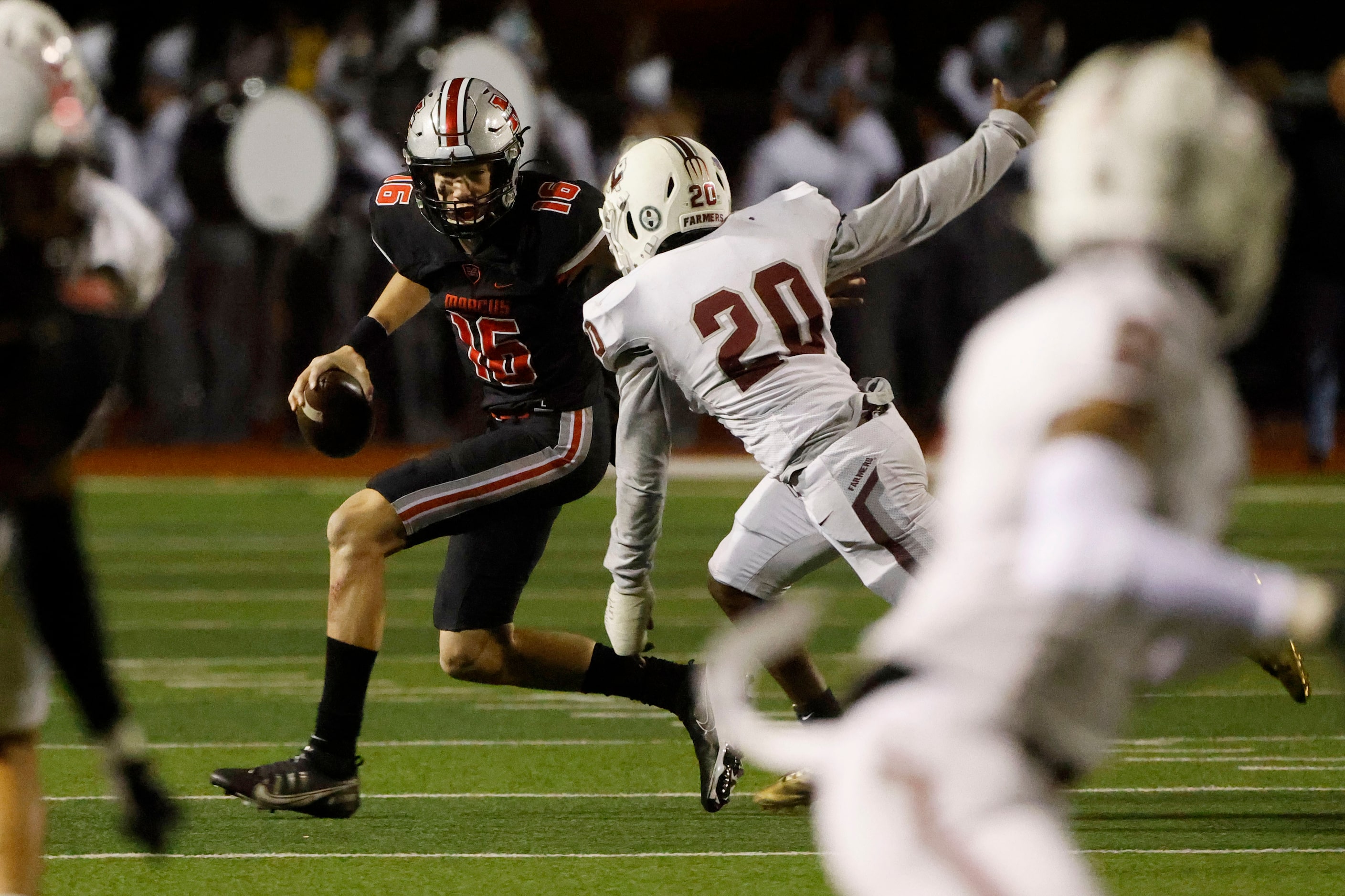 Flower Mound Marcus quarterback Jaxxon Warren (16) is sacked by Lewisville’s Ke’Marion Jones...