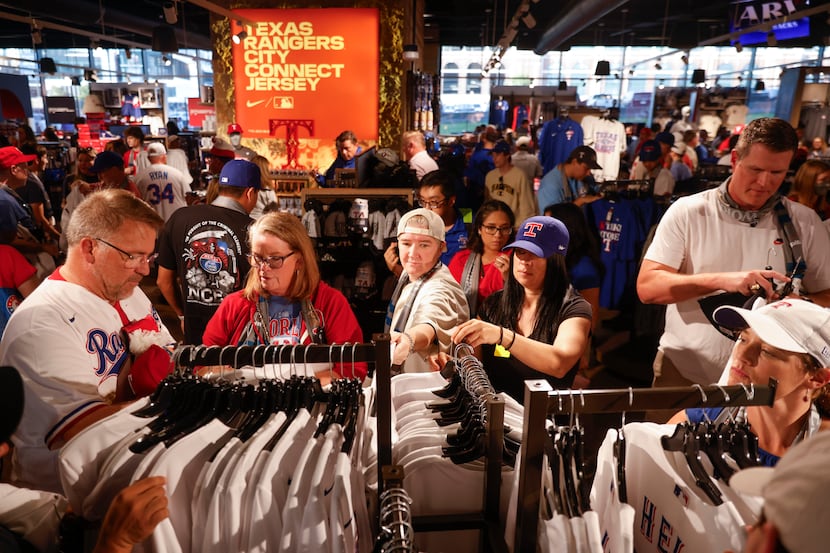 Fans shop inside the Grand Slam Team Store ahead of game 1 of the World Series between Texas...