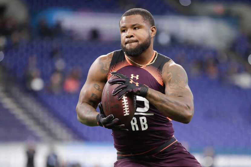 Ohio State running back Mike Weber runs a drill at the NFL football scouting combine in...