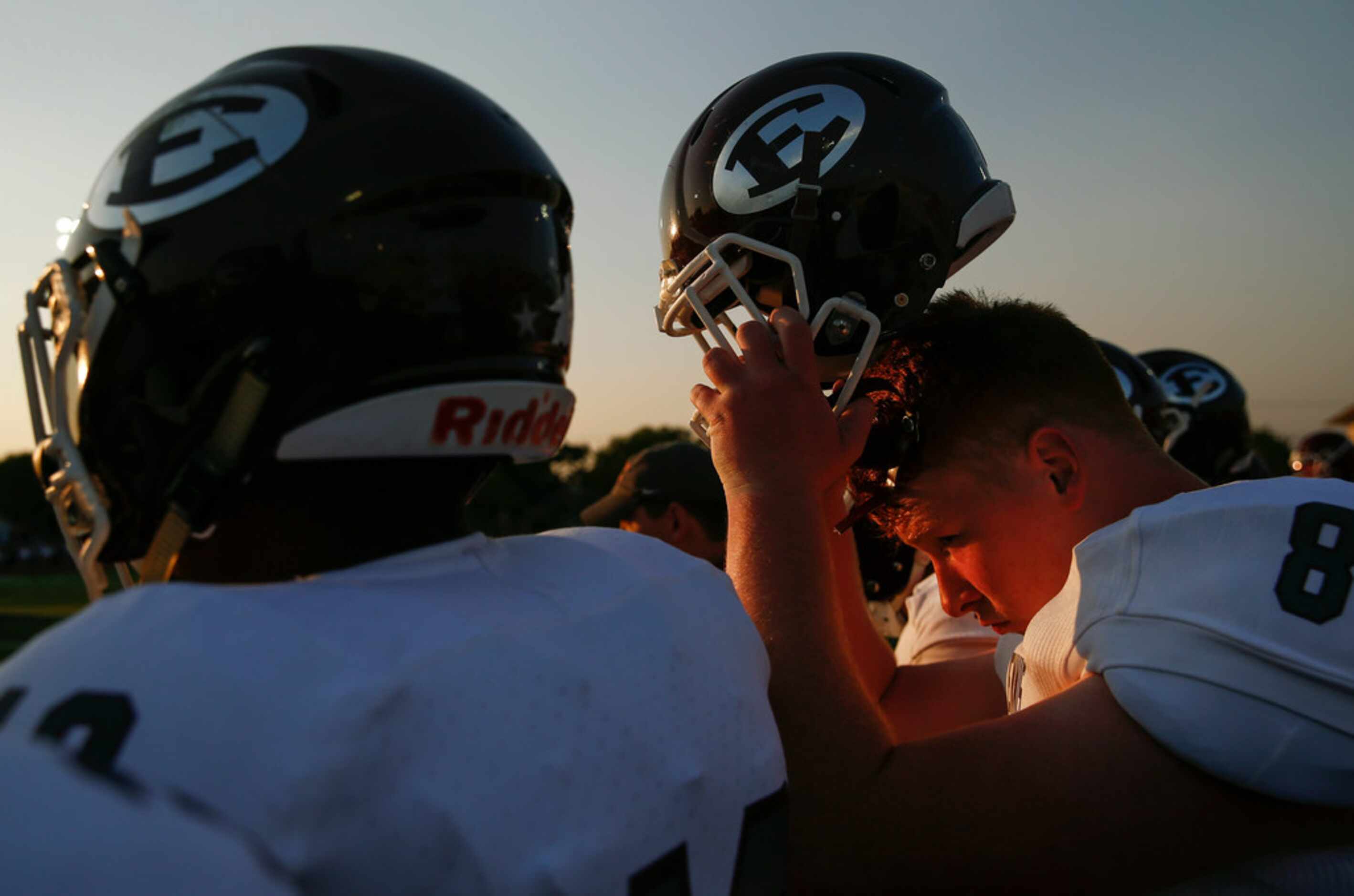 Ennis offensive lineman Dominik Rankin (87) dons his helmet during a high school football...