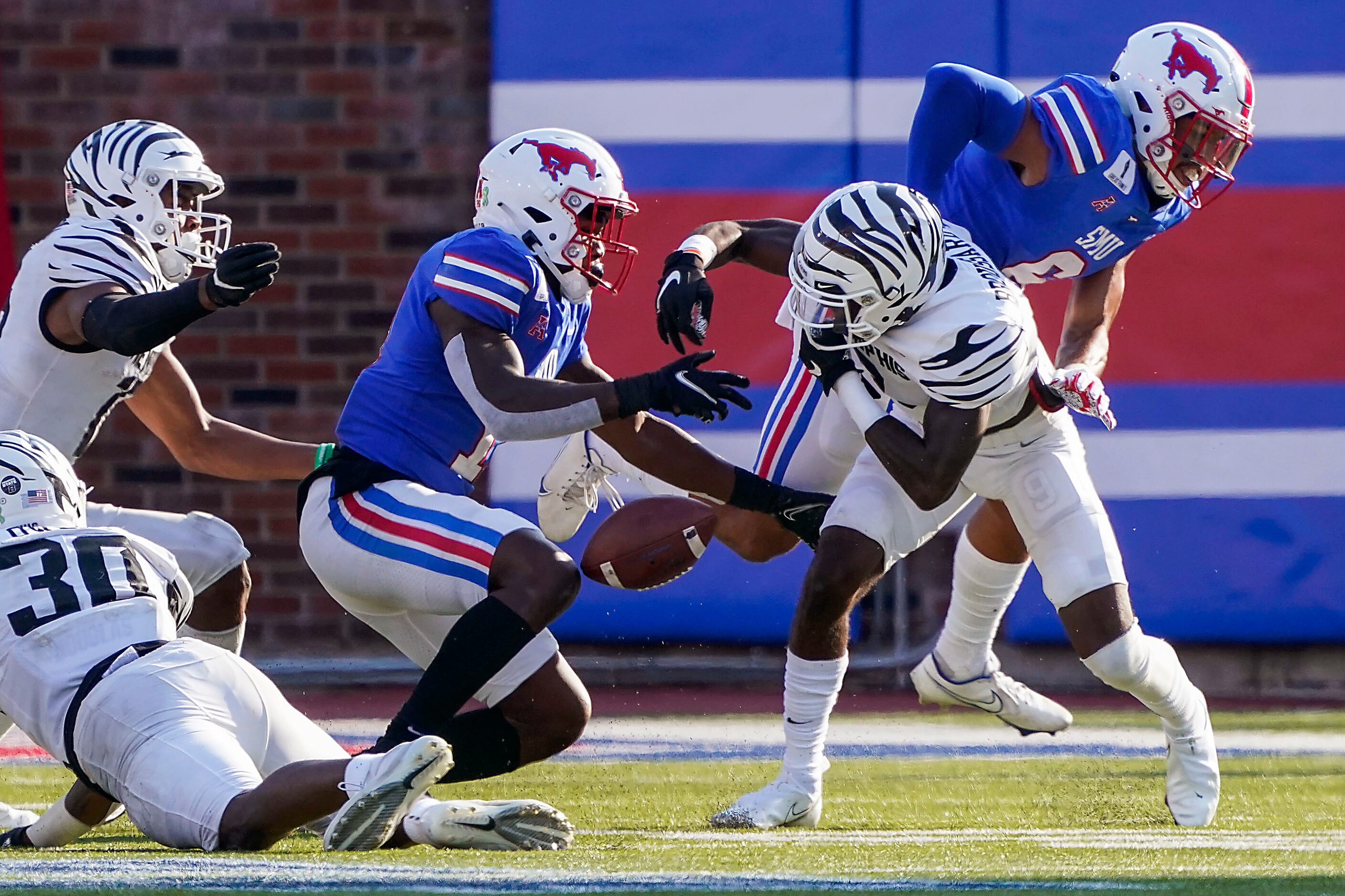 SMU wide receiver Rashee Rice turns the ball over with a fumble after a reception as he is...