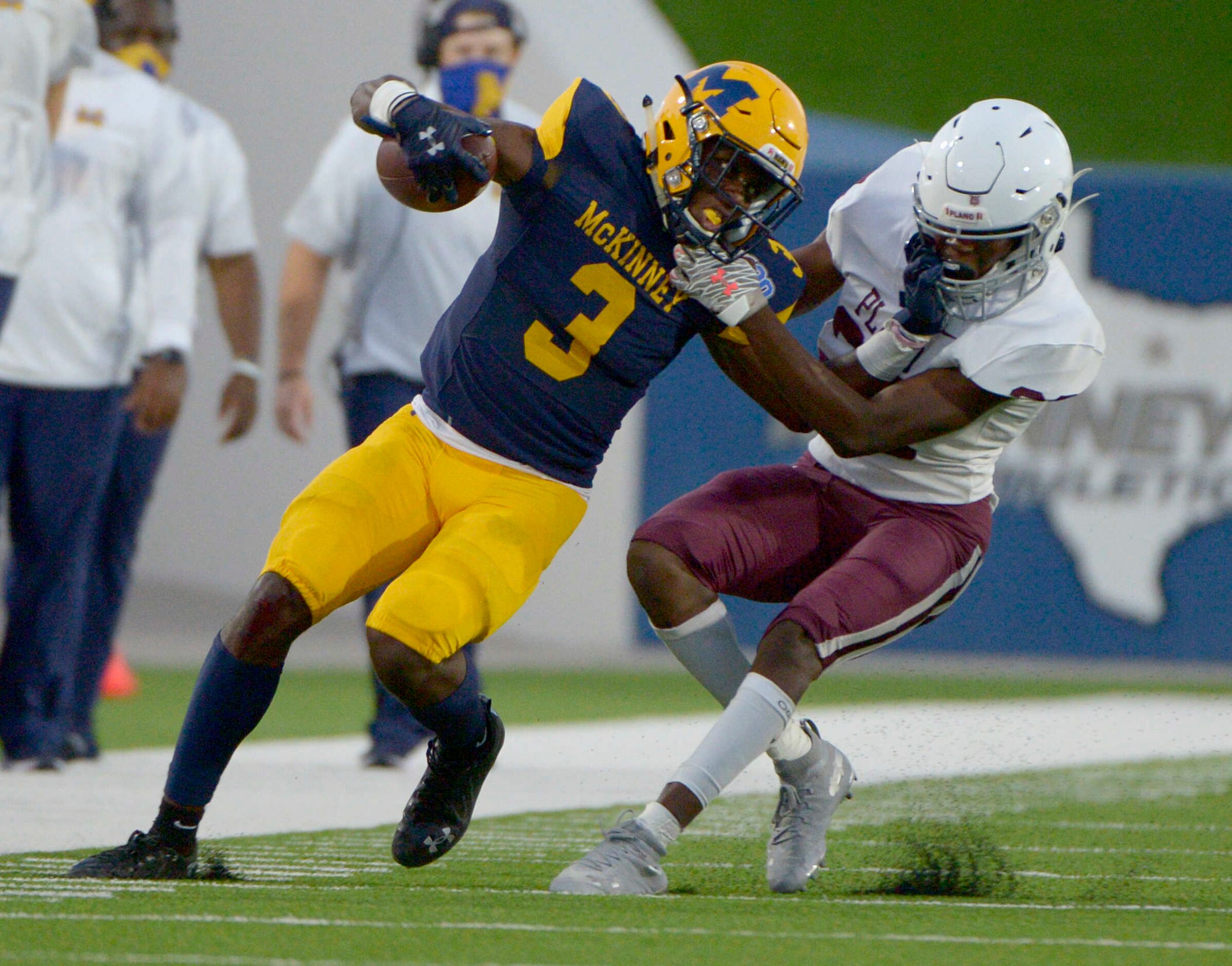 McKinneyÕs Omari Walker (3) tries to run through a tackle attempt by PlanoÕs Jermaine Jamabo...