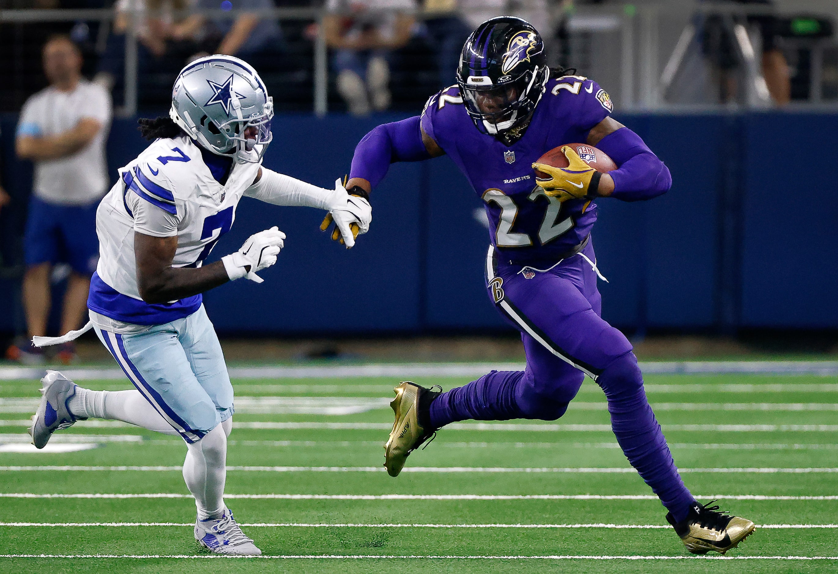 Baltimore Ravens running back Derrick Henry (22) brushes aside Dallas Cowboys cornerback...