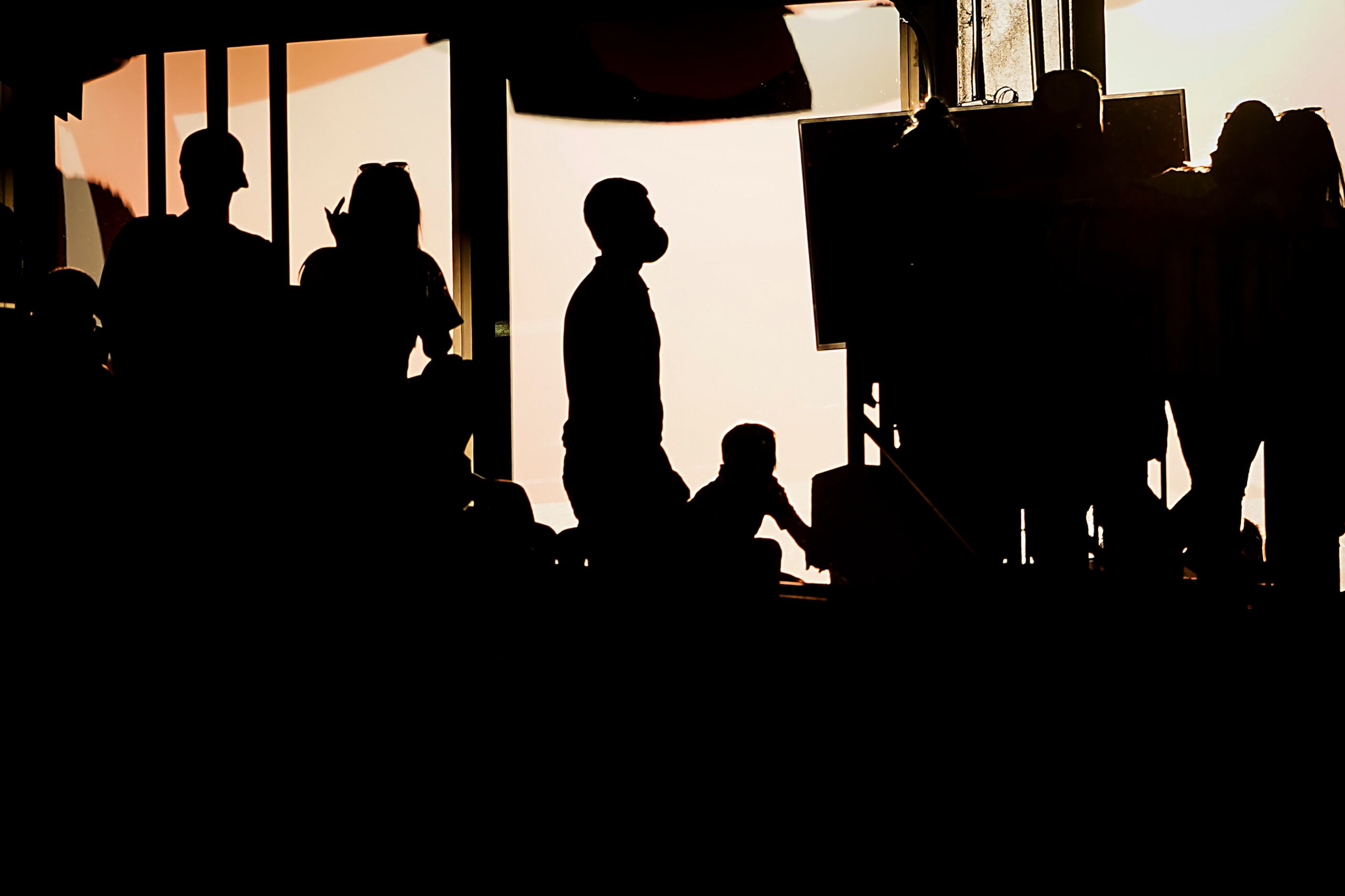 A fan wears a face mask while walking along the outfield upper concourse third inning...