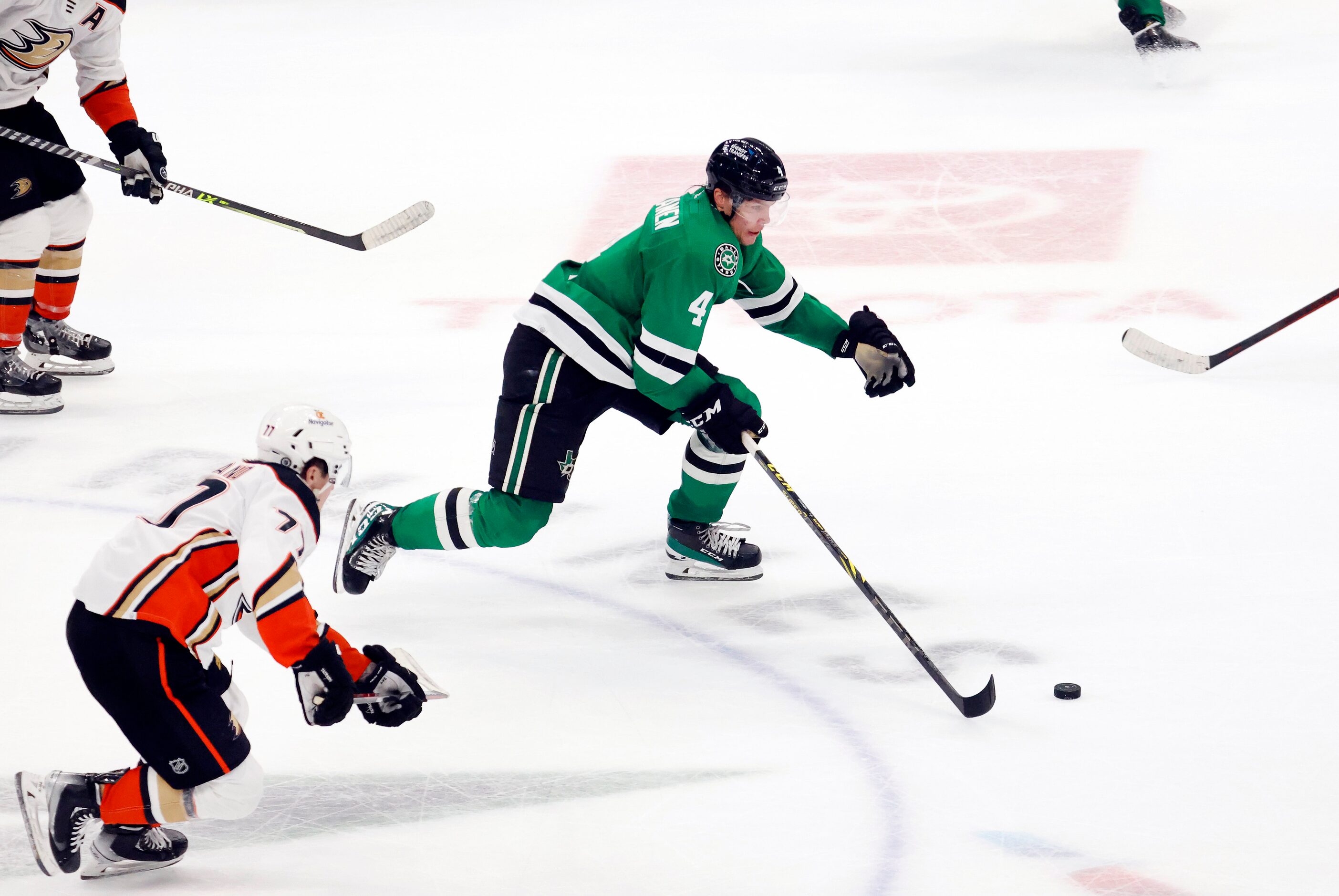 Dallas Stars defenseman Miro Heiskanen (4) breaks away with the puck against Anaheim Ducks...