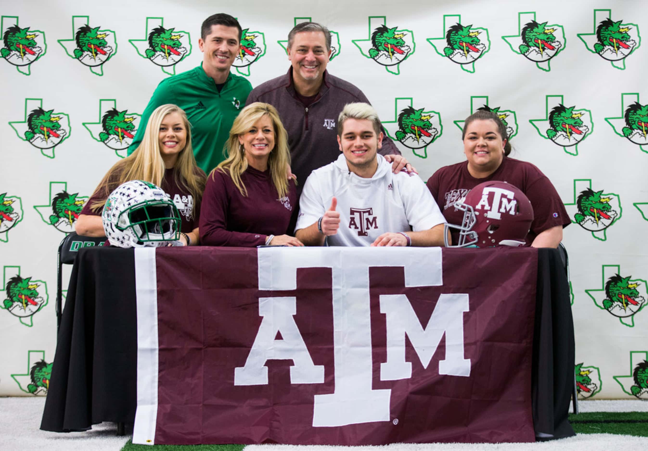 Southlake Carroll football player Blake Smith poses for a photo with his family and...