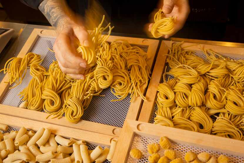 Giuliano Matarese grabs fresh pasta to make Tonnarelli Cacio e Pepe at his new Italian...