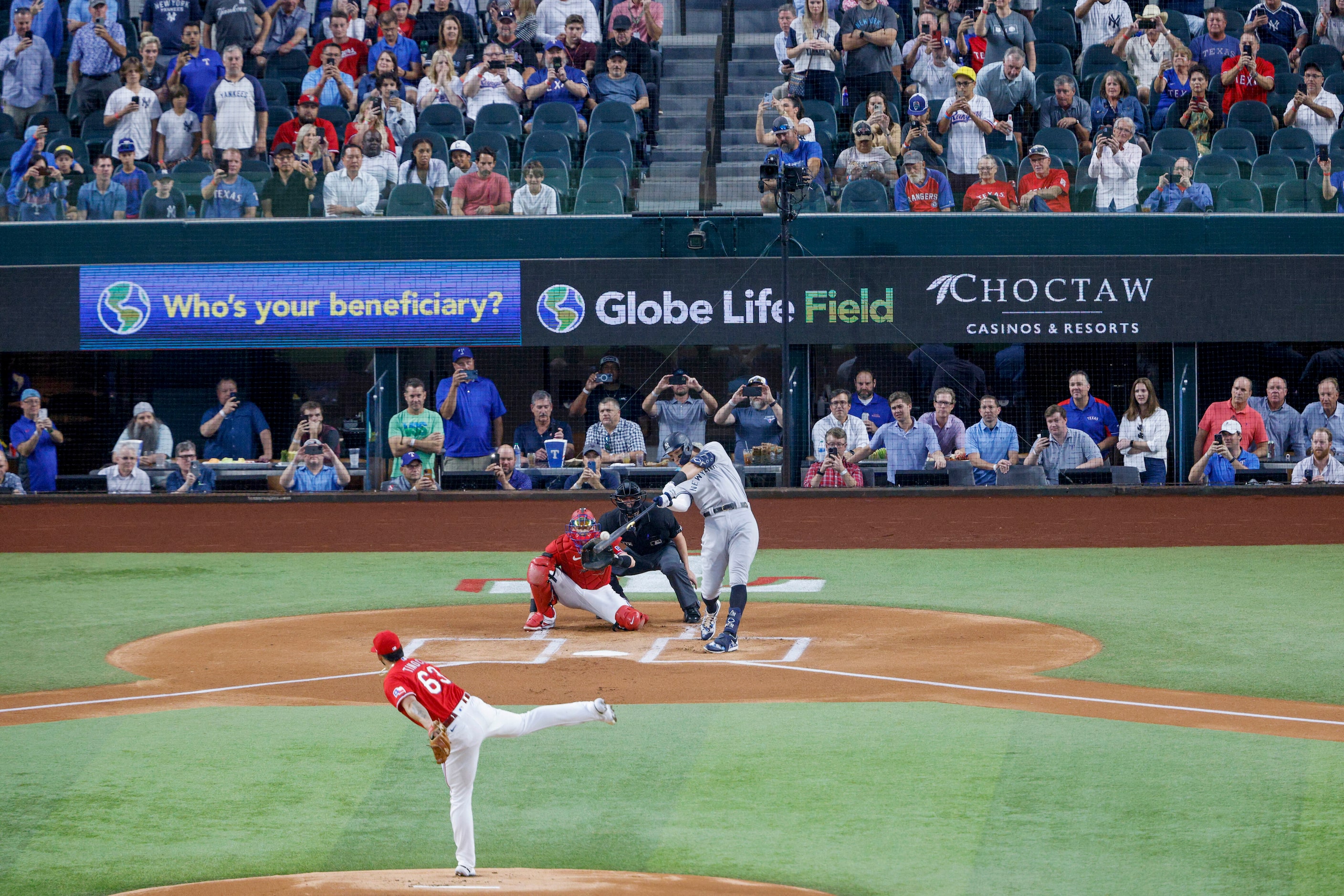 New York Yankees right fielder Aaron Judge (99) hits a home run to left field off Texas...