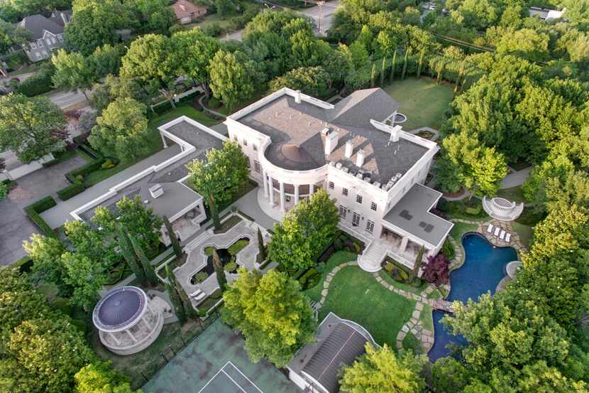Called the White House of Dallas, the more than 16,000-square-foot Strait Lane home has nine...