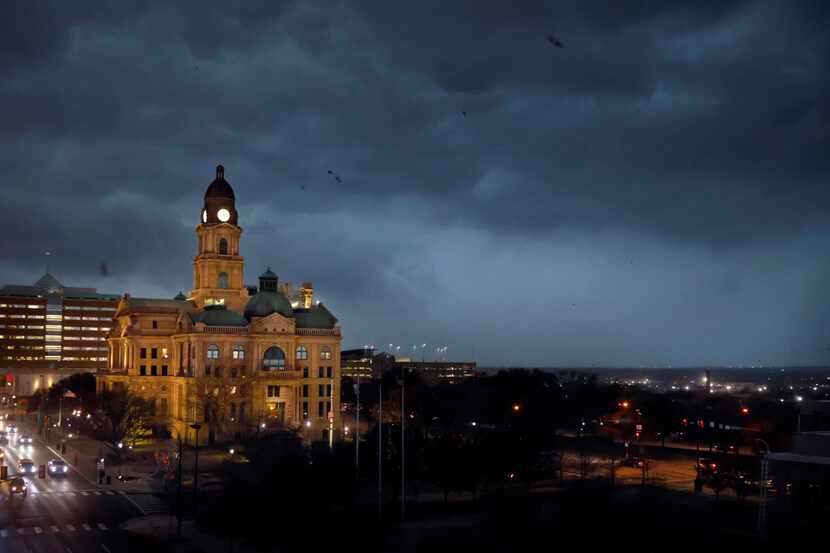 A line of storms approach the old Tarrant County Courthouse in downtown Fort Worth.