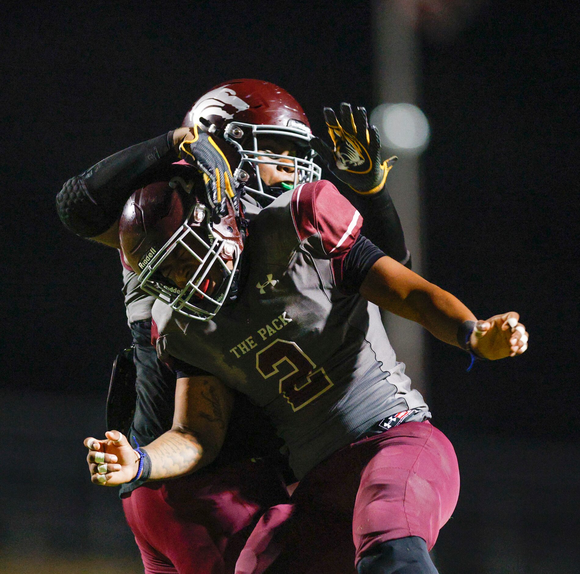 Mansfield Timberview linebacker Joel Ardern (2) celebrates a sack with defensive lineman...