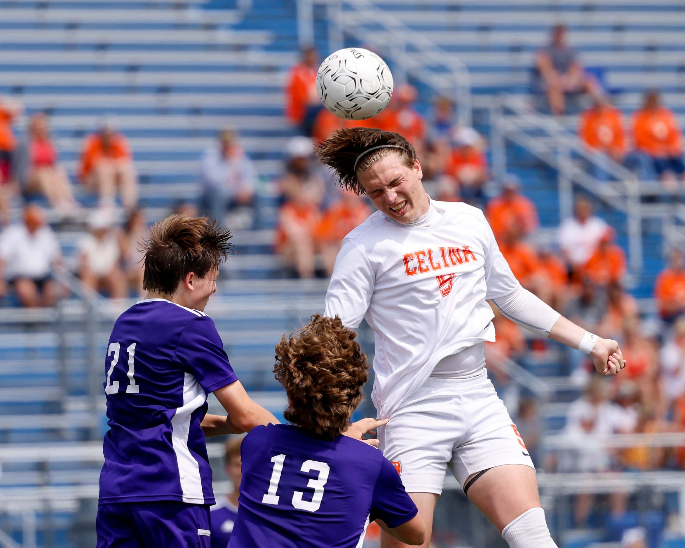 Celina forward Seth Brown (5) heads the ball over Boerne’s Logan Walter (13) and Boerne...