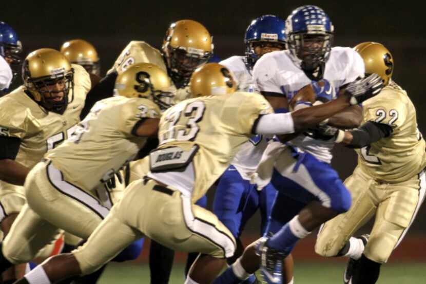 Seagoville running back Dontrail Russell couldn’t shake the South Oak Cliff defense during...