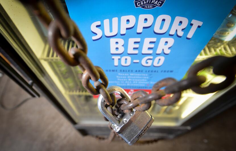 A chained and locked cooler of Oak Highlands Breweryâs six packs awaits September 1 when...