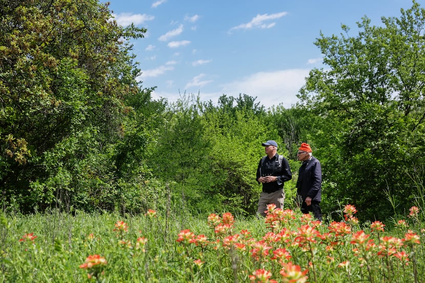 Naturalist Ben Sandifer (left) and Father Tim Gollob (right) talk as they look for birds...