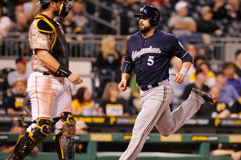 PITTSBURGH, PA - SEPTEM BER 10:  Nevin Ashley #5 of the Milwaukee Brewers scores on a RBI...