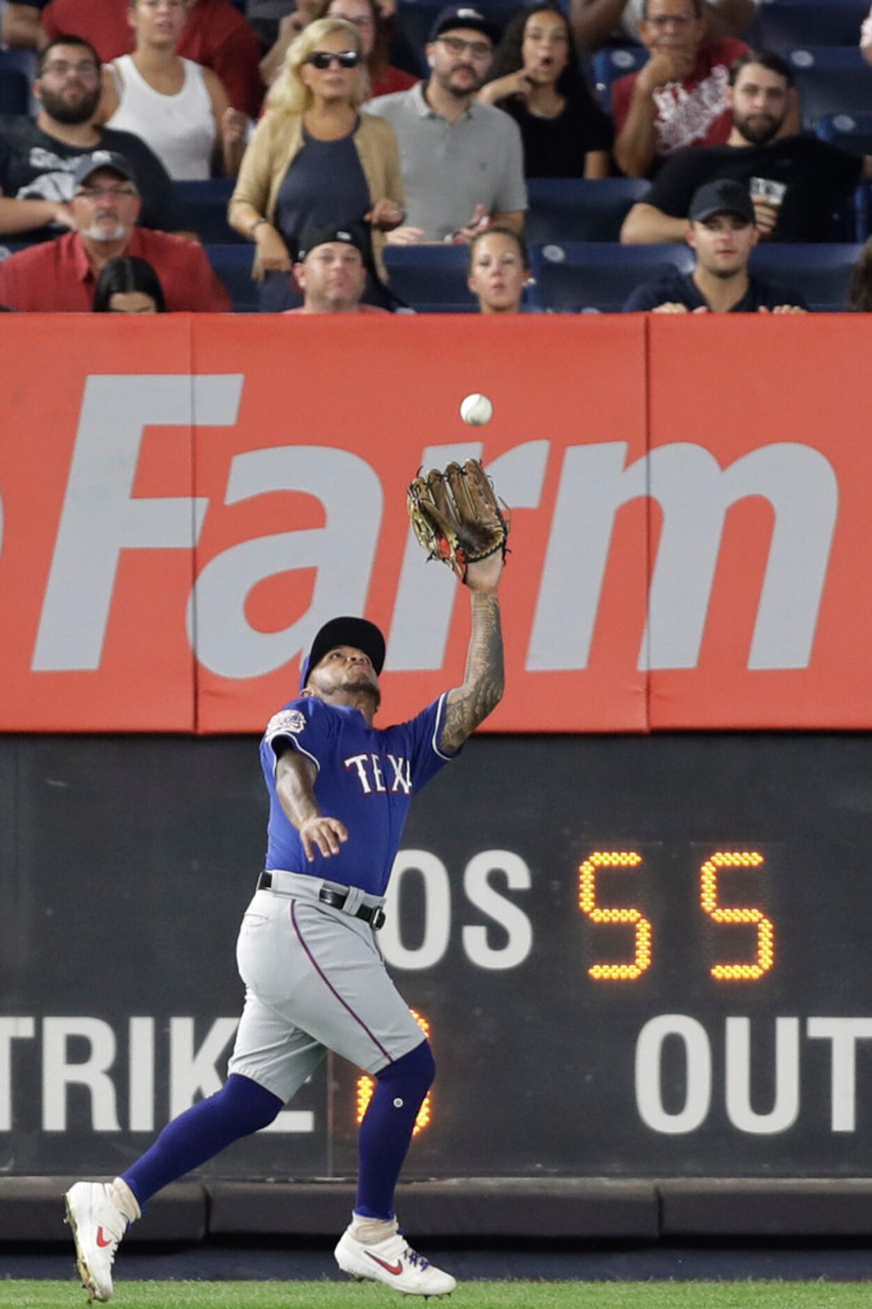 Texas Rangers left fielder Willie Calhoun catches a line drive by New York Yankees' Didi...