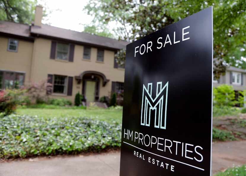 This April file photo shows a "For Sale" sign posted in front of a home in Charlotte, N.C.