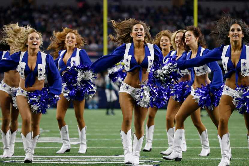 Dallas Cowboys cheerleaders perform on the field during the second quarter against...
