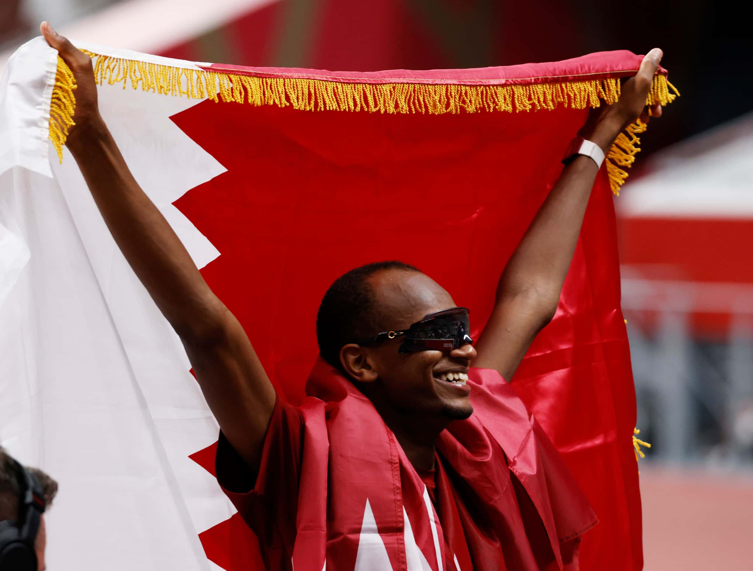 Qatar’s Mutaz Essa Barshim celebrates after winning a gold medal in the men’s high jump...