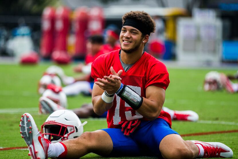 Defensive back Jordan Wyatt (15) stretches during SMU's first football practice of the...