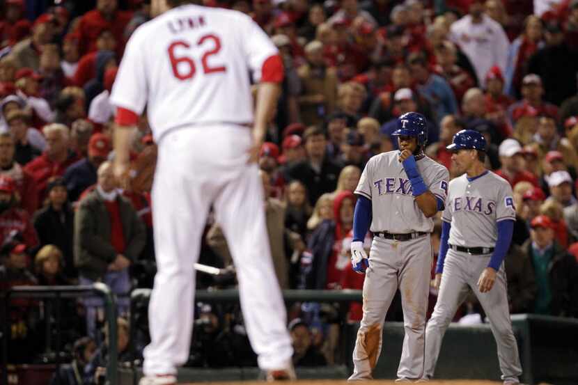 Texas Rangers shortstop Elvis Andrus (1) watches home plate as St. Louis Cardinals relief...
