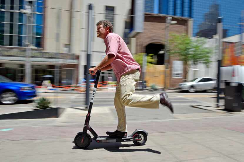 Vyrl Naumann, 52, of Prosper test rode a Bird electric scooter in downtown Dallas last June,...